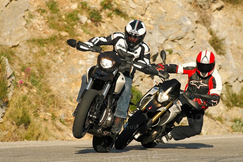 Two Motorcycles driving on the road