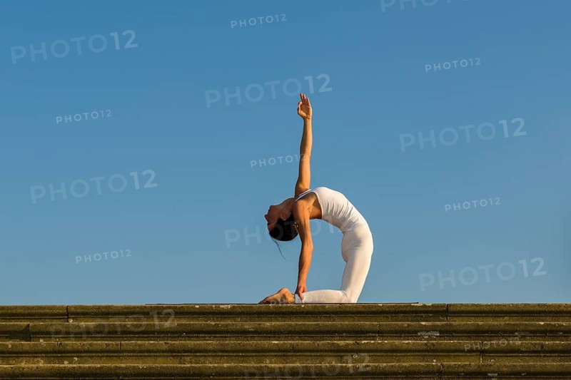Young woman practising Hatha yoga