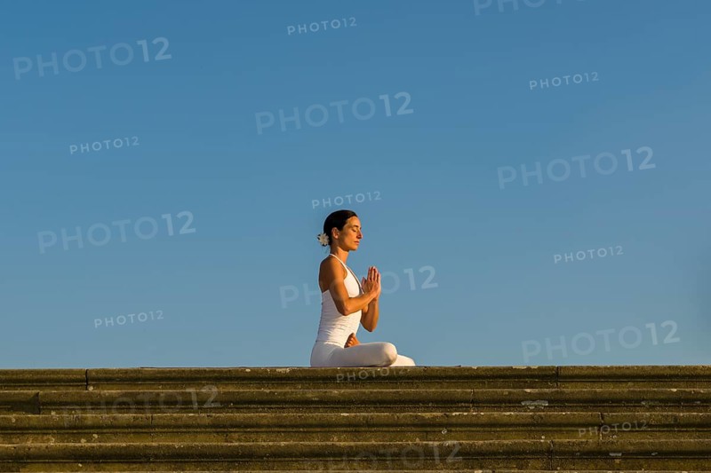Young woman practising Hatha yoga