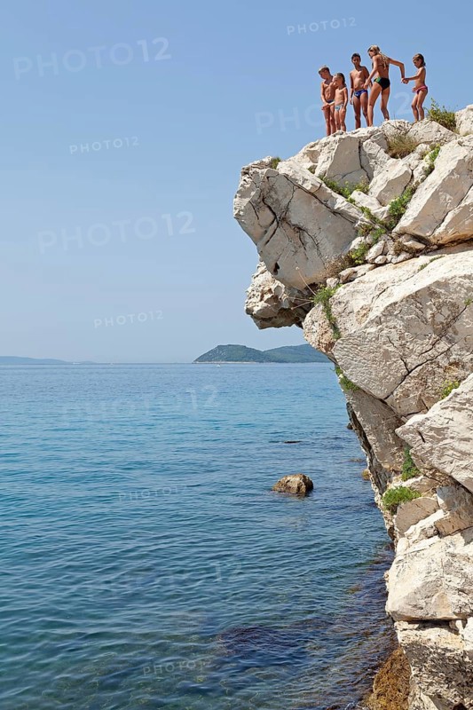 Children standing on cliff
