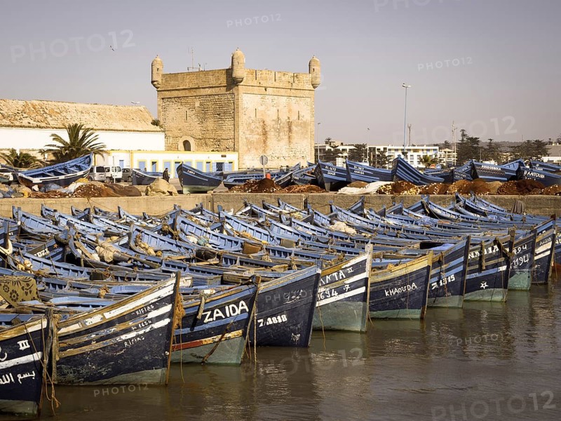 Old blue fishing boats in the port of Essaouira