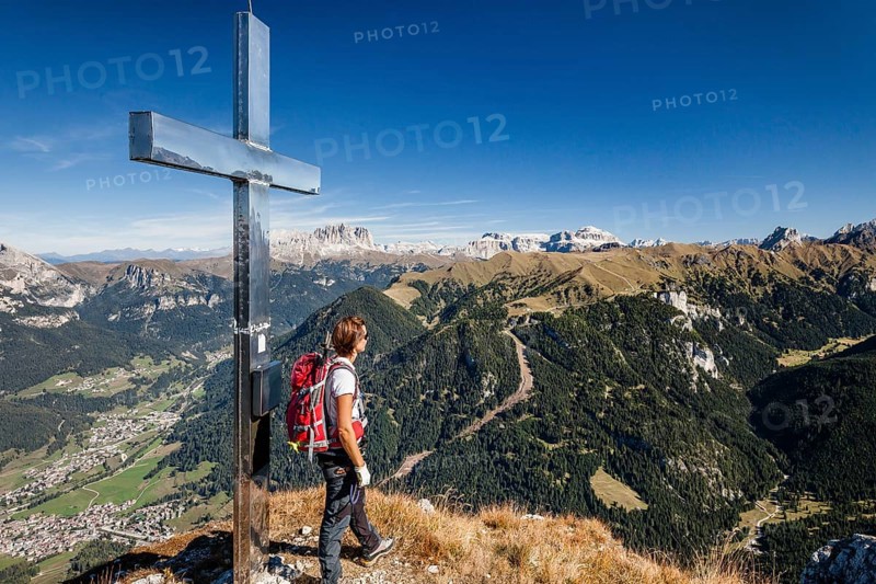 Mountaineer on the summit of Cima Dodici