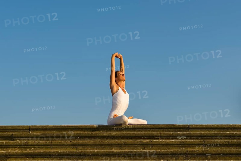 Young woman practising Hatha yoga