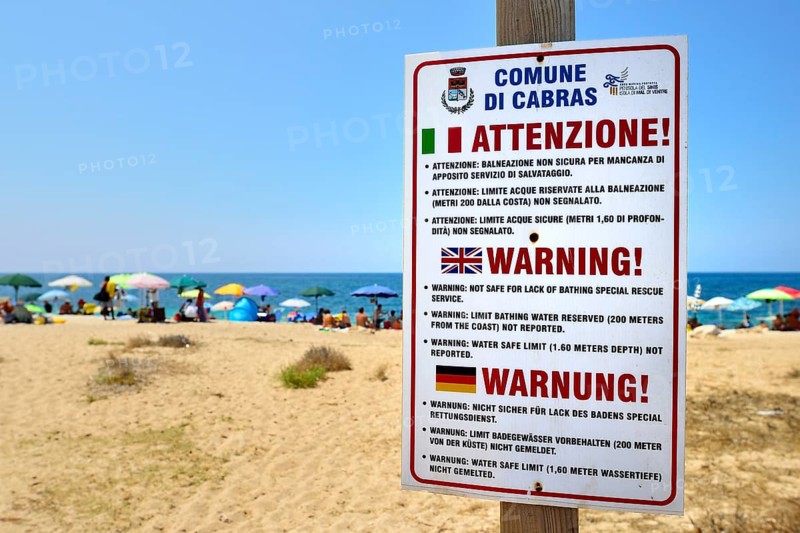 Funny German translation on a warning sign on the beach