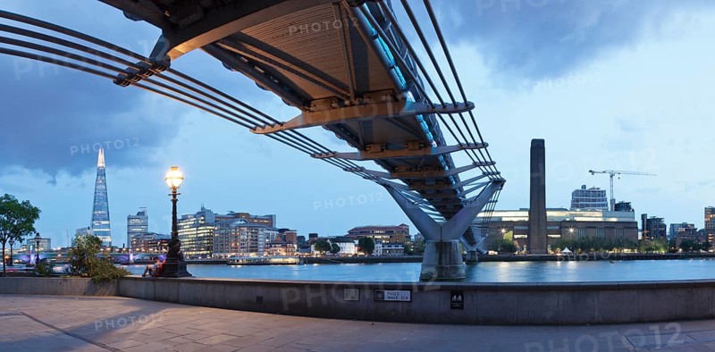 Millennium Bridge from below with views of The Shard skyscraper and Tate Modern
