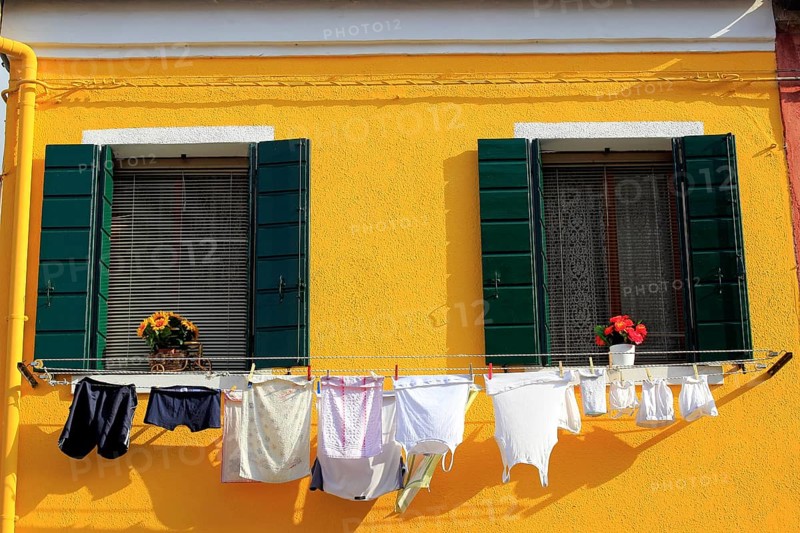 Clothesline on a yellow facade
