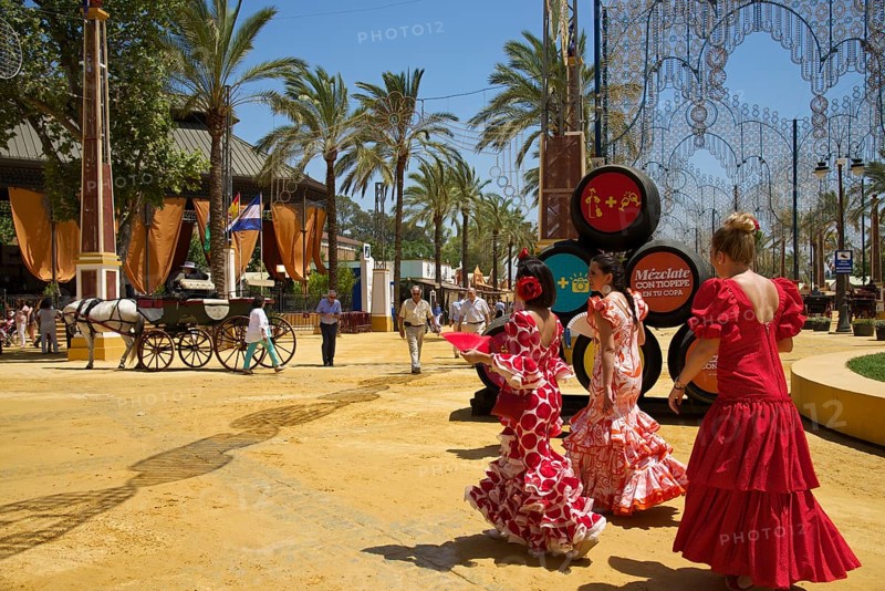 Women in flamenco dresses at the Feria del Caballo