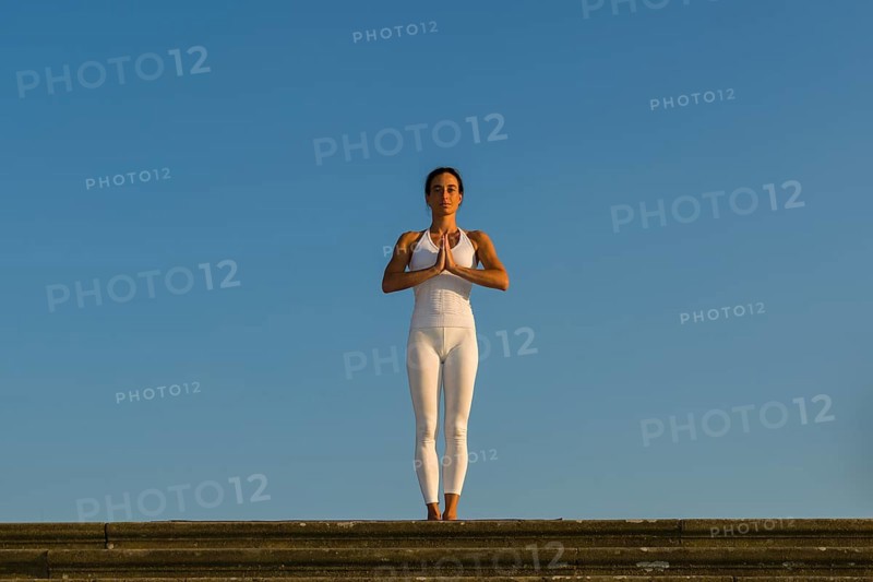Young woman practising Hatha yoga