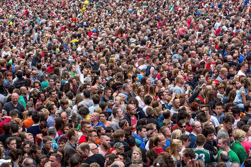 Densely packed crowd at a public festival