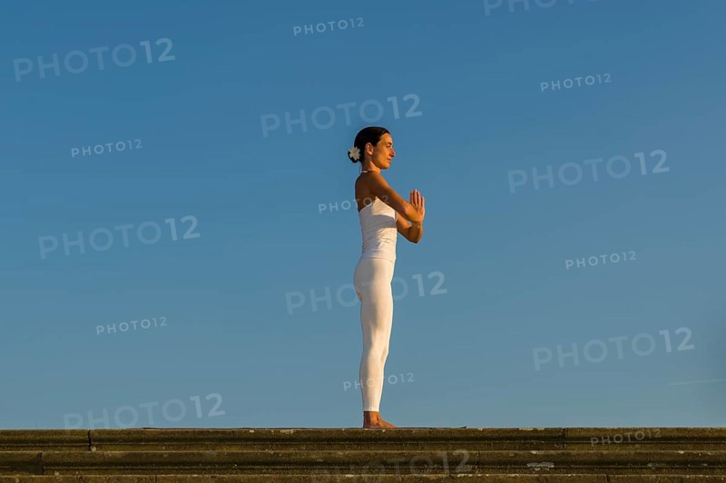 Young woman practising Hatha yoga