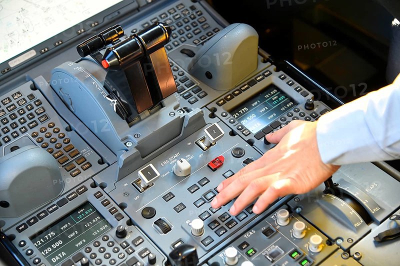 Cockpit with hand on the switch