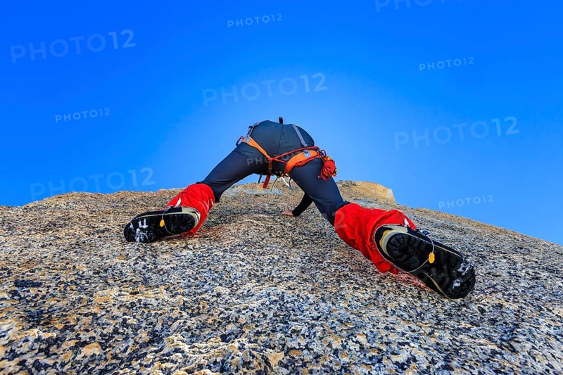 Climber climbing on a rock wall
