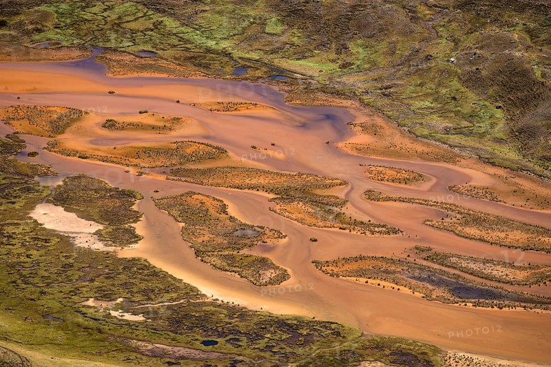 Small meandering river carries large quantities of sediments