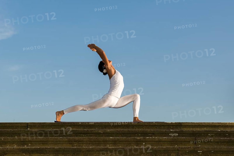 Young woman practising Hatha yoga