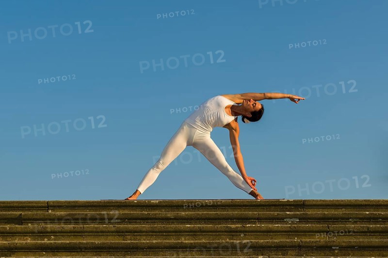 Young woman practising Hatha yoga