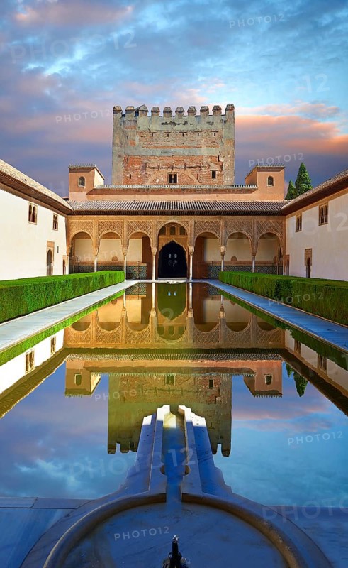 Arabesque Moorish architecture and pond of the Court of the Myrtles of the Palacios Nazaries