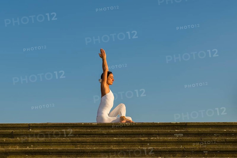 Young woman practising Hatha yoga