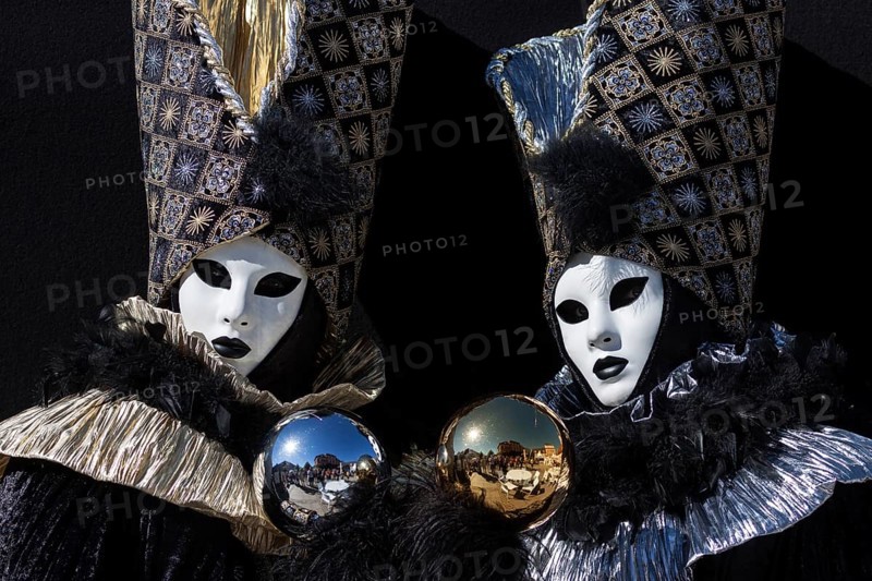 Venetian Carnival masks and costumes at the Venetian Fair on the historic market square