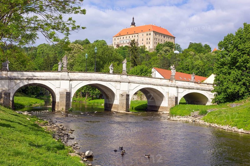 Baroque bridge with statues of Joseph Winterhalder and Namest nad Oslavou Chateau
