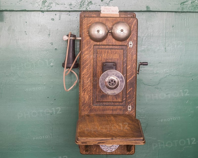 Old telephone with crank in the Museum City