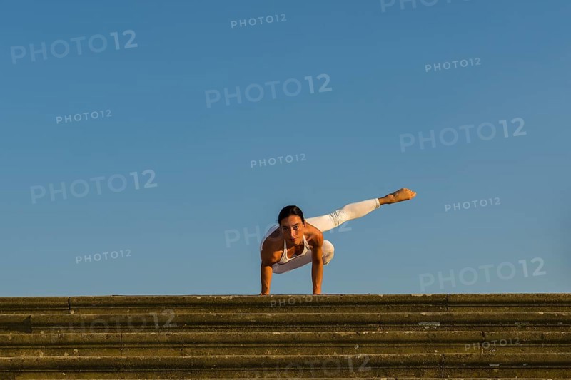 Young woman practising Hatha yoga