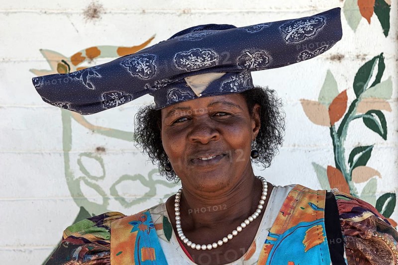 Local Herero woman wearing typical headdress and dress