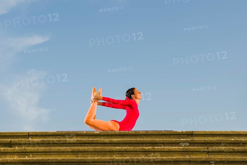 Young woman practising Hatha yoga