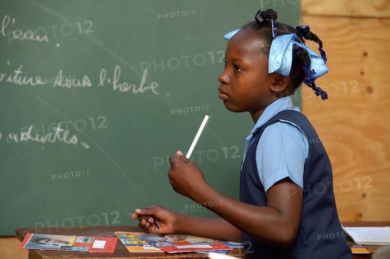Student in a school for earthquake refugees