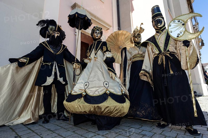 Venetian Carnival masks and costumes at the Venetian Fair on the historic market square