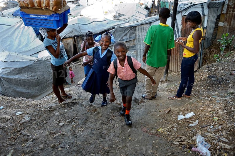 Brother and sister in school uniform on the way to school