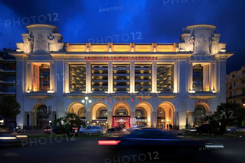 Hotel and Casino Palais de la Mediterranee on the Promenade des Anglais in the evening