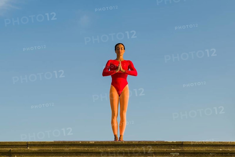 Young woman practising Hatha yoga