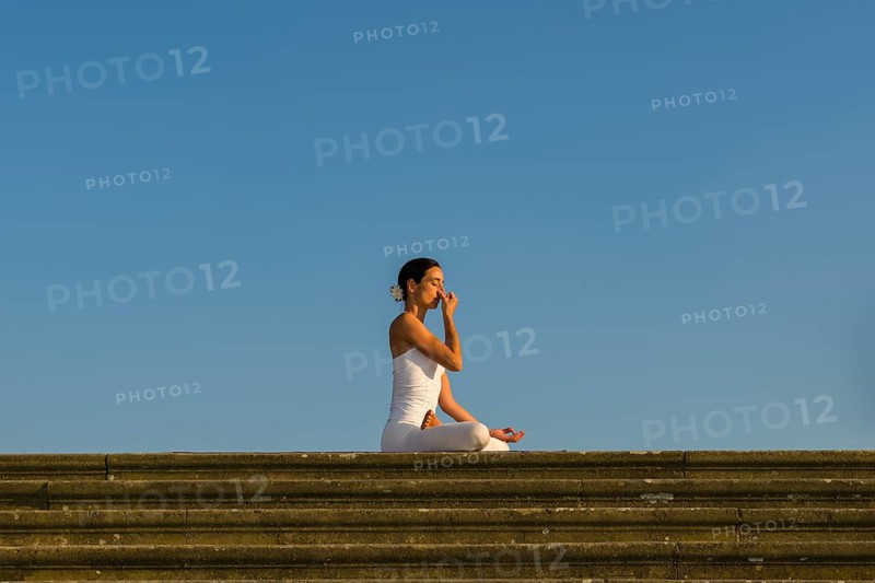 Young woman practising Hatha yoga