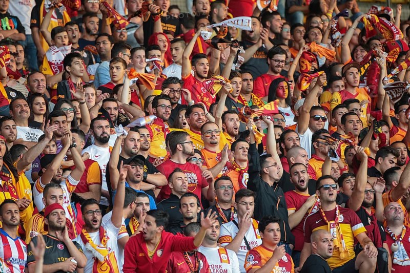 Fans of Galatasaray Istanbul cheer on their team during a friendly game against SK Rapid Vienna