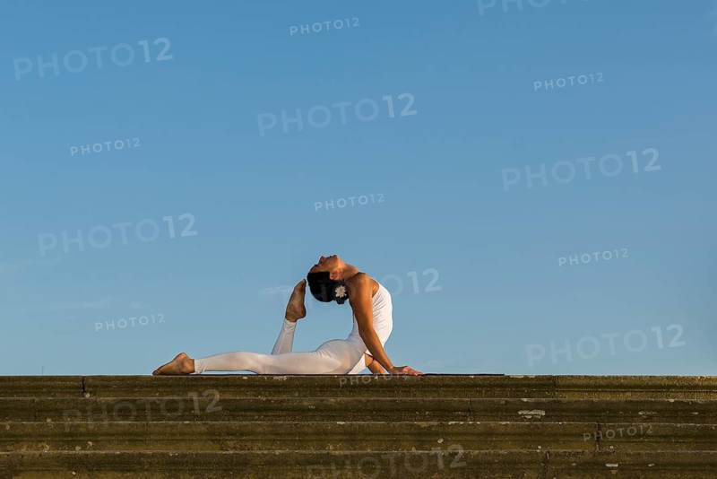 Young woman practising Hatha yoga