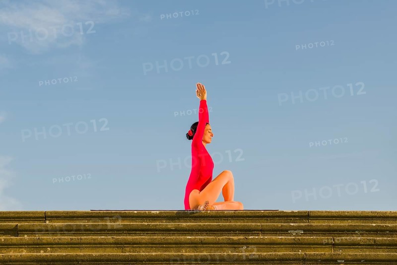 Young woman practising Hatha yoga
