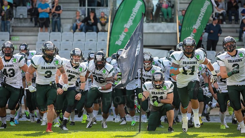 The team of the Danube Dragons runs on the field before an Austrian Football League game