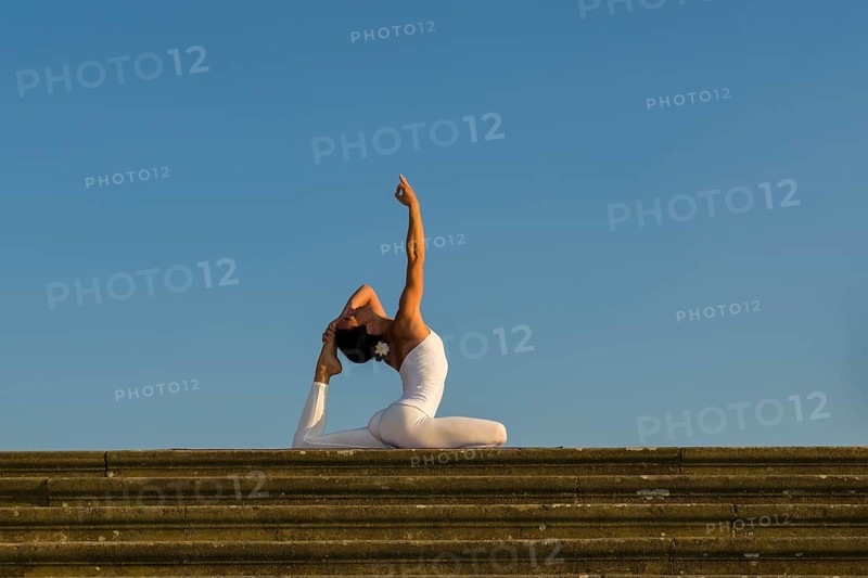 Young woman practising Hatha yoga