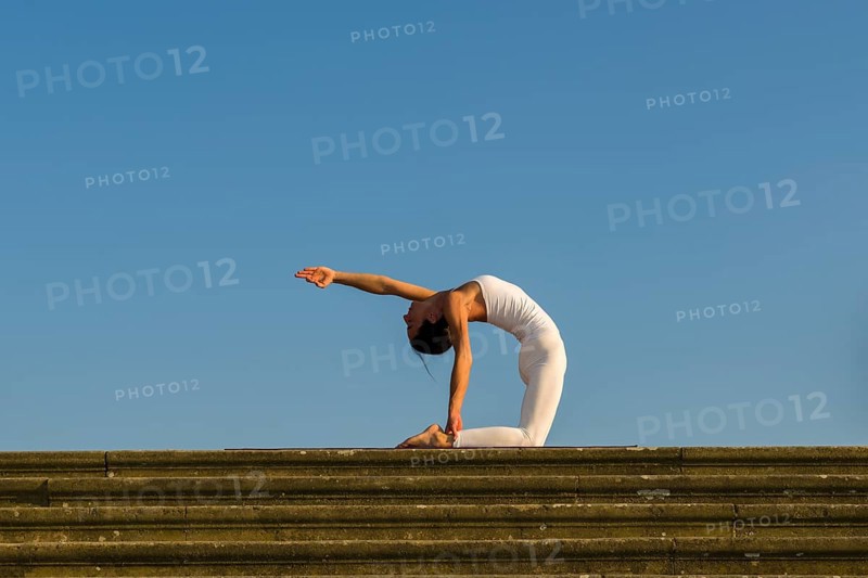 Young woman practising Hatha yoga
