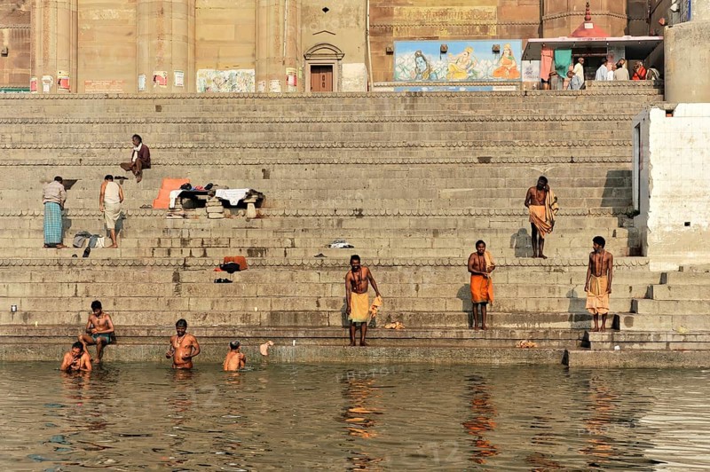 Devotees in ritual ablutions on the banks of the Ganges