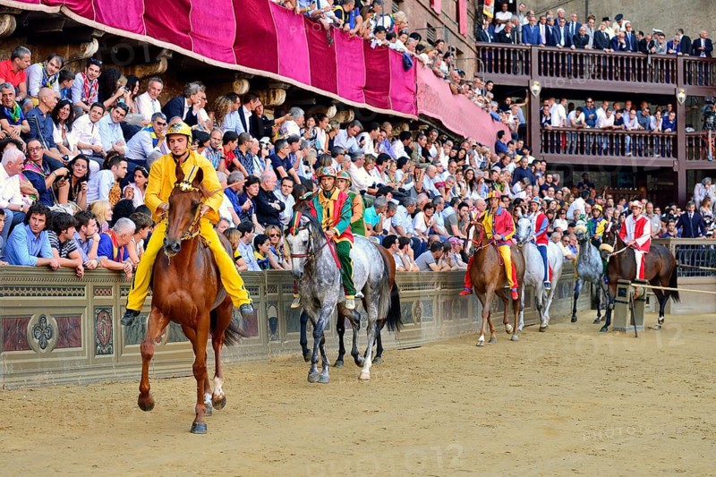 Horses and riders before the start of the historical horse race Palio di Siena