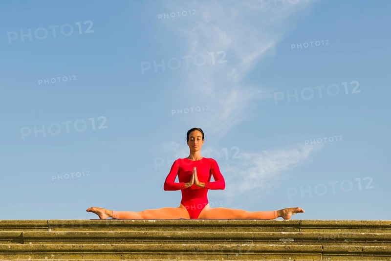 Young woman practising Hatha yoga