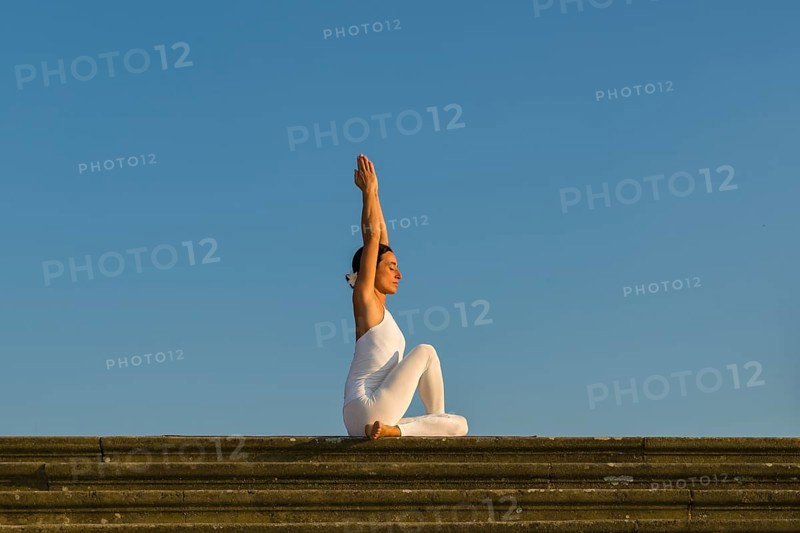 Young woman practising Hatha yoga