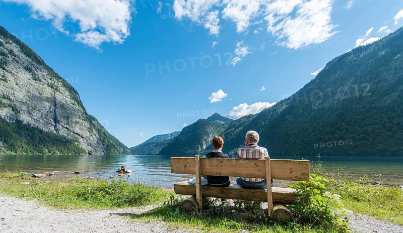 Two people sitting on a bench