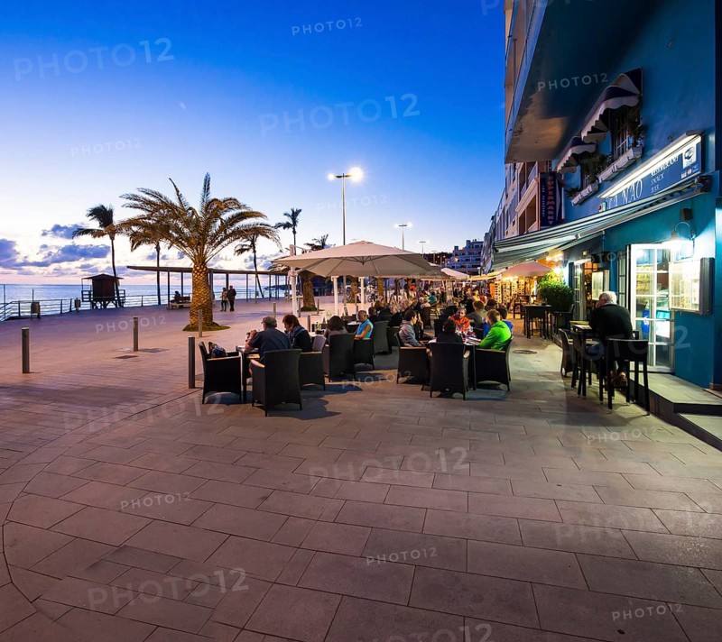 Coastal town of Puerto De Naos with restaurants in the evening