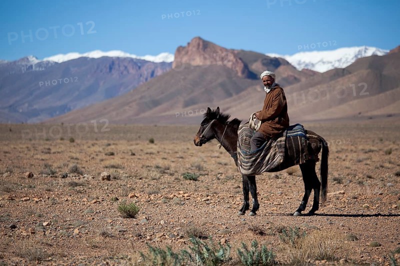 Nomad Berber riding a horse