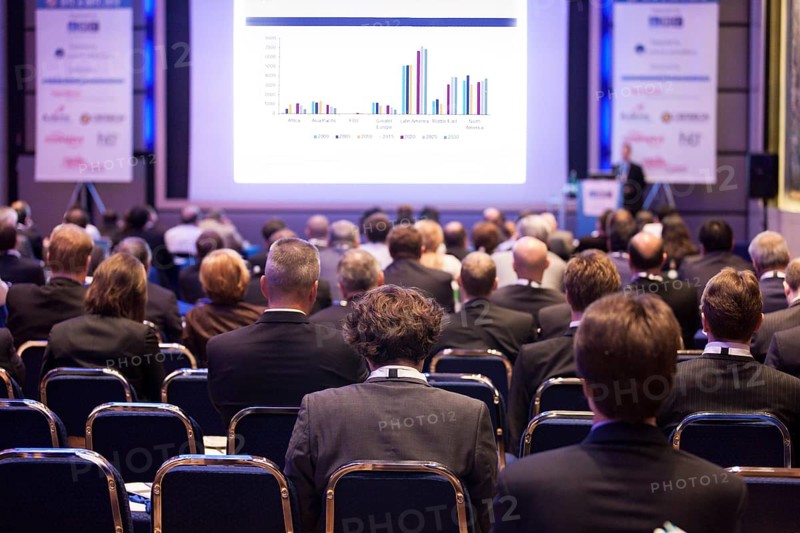 Delegates watching a business presentation during a conference