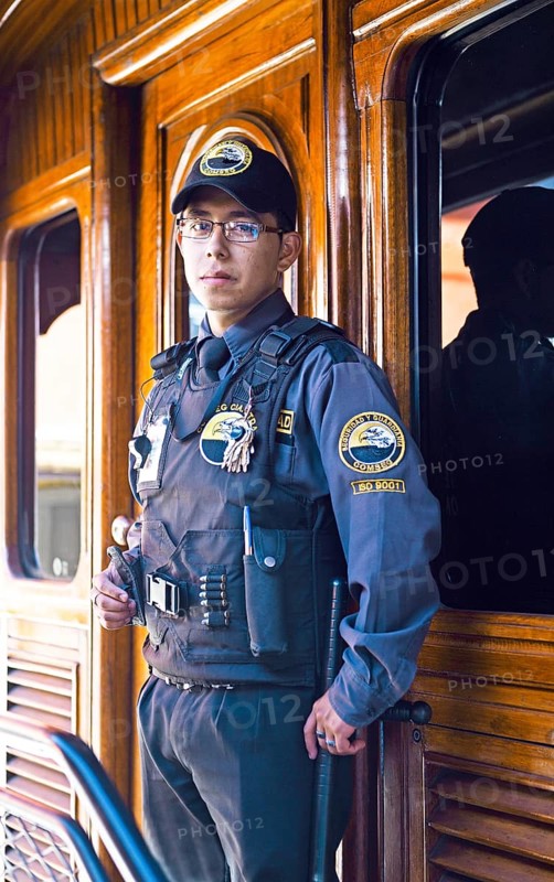 Security officer in a carriage of the Andean railway Nariz del Diablo or Devil's Nose