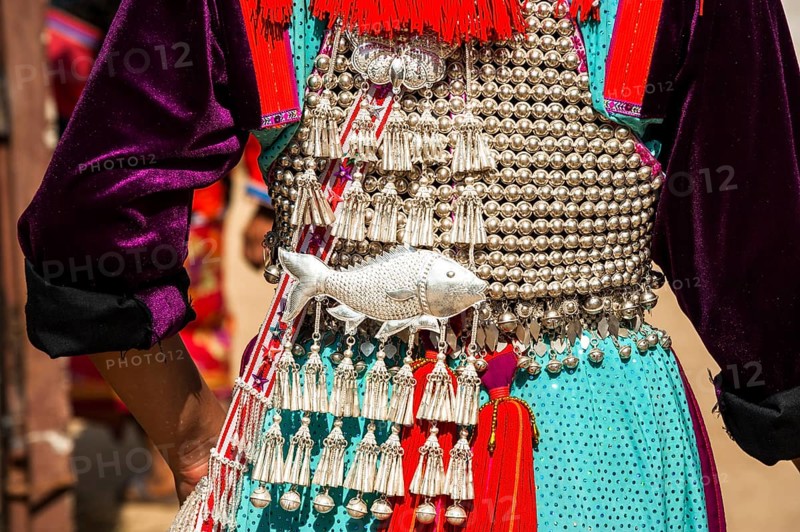 Traditionally decorated dress a woman from the Lisu people