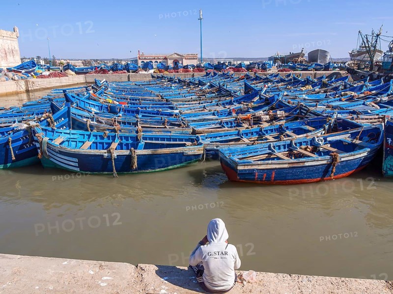 Old blue fishing boats in the port of Essaouira